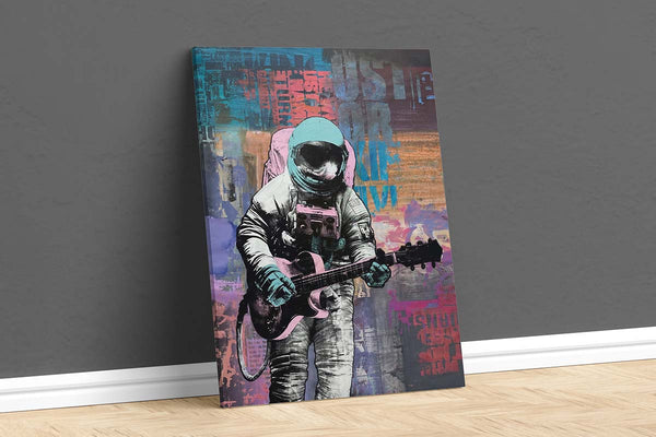 an art canvas of a person in a spacesuit playing the guitar