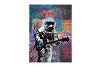 an art canvas of a person in a spacesuit playing the guitar